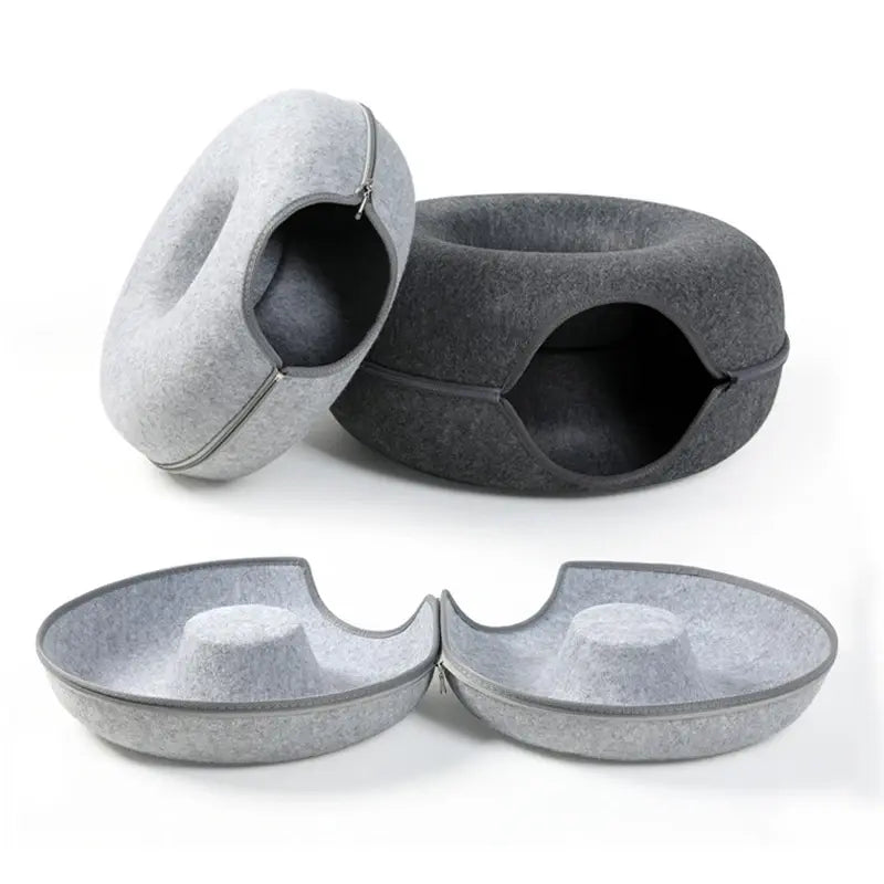 Gray pet bed and two bowls on a white background