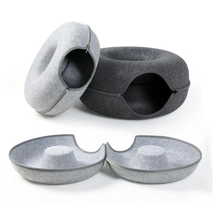 Gray pet bed and two bowls on a white background