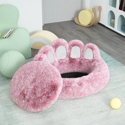 Pink paw-shaped pet bed on a light green rug with colorful chairs in the background