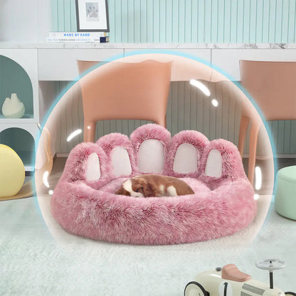 Pink paw-shaped pet bed on a chair with a blurred background