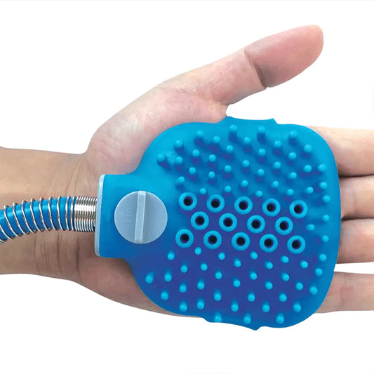 Blue silicone hand scrubber with a hose attachment on a white background