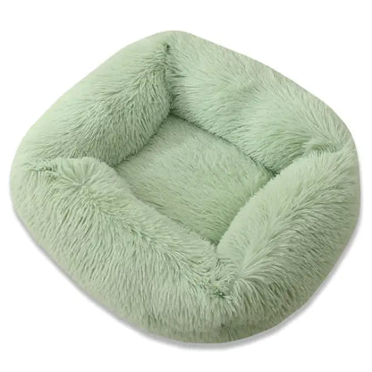 Green fluffy pet bed on a white background