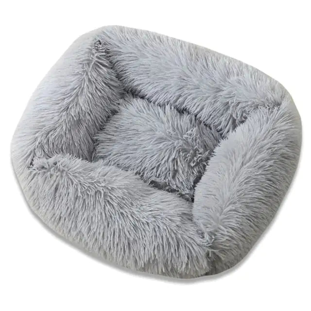Fluffy gray pet bed on a white background
