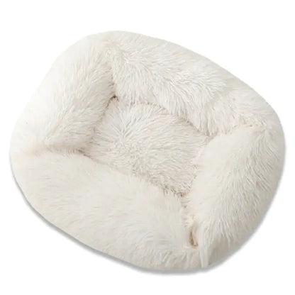 White fluffy donut-shaped pillow on a white background